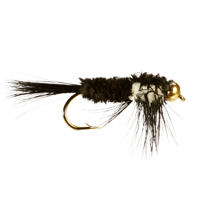 A photograph of a single montana fishing fly with a black and white body, gold-colored head, and furry legs.